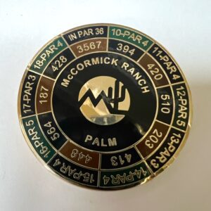 A round pin with the words mccormick ranch in different colors.